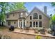Spacious backyard featuring a patio with seating and a firepit perfect for outdoor enjoyment at 10319 Remembrance Trl, Huntersville, NC 28078