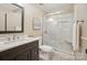 Bathroom featuring marble countertops, stylish vanity, and glass-enclosed shower at 10319 Remembrance Trl, Huntersville, NC 28078