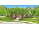 Well-maintained clubhouse with brick facade, manicured lawn, and mature trees at 10319 Remembrance Trl, Huntersville, NC 28078