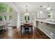 Dining room with hardwood floors next to the kitchen and flooded with natural light at 10319 Remembrance Trl, Huntersville, NC 28078