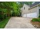 Spacious driveway and two-car garage offers ample parking at 10319 Remembrance Trl, Huntersville, NC 28078