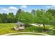A charming gazebo nestled in a beautifully landscaped area, providing a serene outdoor retreat for residents at 10319 Remembrance Trl, Huntersville, NC 28078