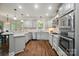 Well-equipped kitchen with stainless steel appliances and granite countertops at 10319 Remembrance Trl, Huntersville, NC 28078