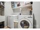 Functional laundry room featuring a modern washer and dryer, ample storage, and efficient layout for convenience at 10319 Remembrance Trl, Huntersville, NC 28078