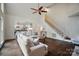 Open-concept living area featuring hardwood floors, a fireplace, and staircase at 10319 Remembrance Trl, Huntersville, NC 28078