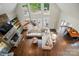 Overhead view of the open living room with fireplace, vaulted ceiling and hardwood floors at 10319 Remembrance Trl, Huntersville, NC 28078