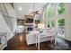 Bright living room with stone fireplace, built-in shelving, and hardwood flooring at 10319 Remembrance Trl, Huntersville, NC 28078