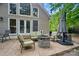 Outdoor patio featuring comfortable seating, a fire pit, and an umbrella for relaxing moments at 10319 Remembrance Trl, Huntersville, NC 28078