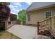 Charming backyard patio with an outdoor fireplace, and access to the wooden deck at 1033 Marguerite Dr, Lowell, NC 28098