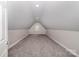 Spacious bonus room featuring plush carpeting, natural light and neutral walls at 1033 Marguerite Dr, Lowell, NC 28098