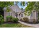 Charming home with brick and vinyl siding, landscaped front yard, and covered entrance at 1033 Marguerite Dr, Lowell, NC 28098