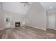 Spacious living room with vaulted ceiling, cozy fireplace, and new floors at 1033 Marguerite Dr, Lowell, NC 28098