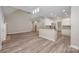 Inviting living room merges with the open kitchen, perfect for entertaining at 1033 Marguerite Dr, Lowell, NC 28098