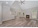 Open living area boasts vaulted ceiling, fireplace, and seamless flow to the kitchen at 1033 Marguerite Dr, Lowell, NC 28098