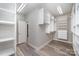 A spacious walk-in closet featuring ample shelving and storage for an organized wardrobe at 1033 Marguerite Dr, Lowell, NC 28098