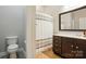 Well-lit bathroom featuring a modern vanity and a full-sized shower at 1038 Gardenia St, Fort Mill, SC 29708