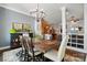 Open-concept dining room with modern chandelier and seamless flow into living area at 1038 Gardenia St, Fort Mill, SC 29708