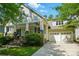 Beautiful home featuring an attached garage, covered porch, and lush landscaping at 1038 Gardenia St, Fort Mill, SC 29708