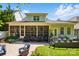 Charming exterior view of home with screened in porch, deck, and well-maintained yard at 1038 Gardenia St, Fort Mill, SC 29708