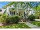 Charming home with a welcoming porch, brick stairs, and a well-manicured front yard at 1038 Gardenia St, Fort Mill, SC 29708