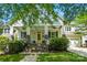 Charming home with a welcoming porch, brick stairs, and a well-manicured front yard at 1038 Gardenia St, Fort Mill, SC 29708