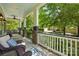 Inviting front porch with comfortable seating, ceiling fan, and scenic views at 1038 Gardenia St, Fort Mill, SC 29708