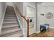 Hallway featuring staircase, laundry room and bench at 1038 Gardenia St, Fort Mill, SC 29708