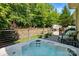 Secluded hot tub area with lush landscaping providing privacy, perfect for relaxation and enjoying the serene outdoor space at 1038 Gardenia St, Fort Mill, SC 29708