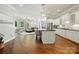 Open-concept kitchen with a central island, modern appliances, and hardwood floors at 1038 Gardenia St, Fort Mill, SC 29708