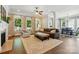 Spacious living room with large windows, fireplace, and hardwood floors at 1038 Gardenia St, Fort Mill, SC 29708