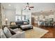 Open-concept living room and kitchen boast hardwood floors, neutral tones, and a spacious layout at 1038 Gardenia St, Fort Mill, SC 29708