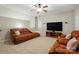 Inviting living room features a ceiling fan, plush seating, and a mounted television for a comfortable entertaining space at 1038 Gardenia St, Fort Mill, SC 29708