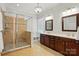 Elegant main bathroom with glass-enclosed shower and double vanity at 1038 Gardenia St, Fort Mill, SC 29708