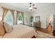 Comfortable main bedroom boasts hardwood floors and an inviting outdoor view at 1038 Gardenia St, Fort Mill, SC 29708