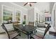 Charming screened-in porch with an outdoor table and seating, perfect for al fresco dining and entertaining at 1038 Gardenia St, Fort Mill, SC 29708