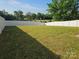 The backyard is enclosed by a white fence, providing privacy and security for outdoor activities at 106 Calderdale Ln, Charlotte, NC 28262