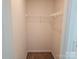 Walk-in closet featuring carpeted flooring, white walls, and wire shelving system for optimal storage and organization at 106 Calderdale Ln, Charlotte, NC 28262
