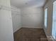 Spacious closet with a window and a shelf and rack closet organizer at 106 Calderdale Ln, Charlotte, NC 28262
