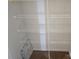 A closet with four metal shelving racks at 106 Calderdale Ln, Charlotte, NC 28262
