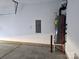 Spacious garage featuring a water heater and electrical panel, offering ample storage and utility space at 106 Calderdale Ln, Charlotte, NC 28262