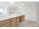 Bright bathroom featuring double vanity, quartz countertops and tiled shower at 111 Stonewater Dr # 25, Red Cross, NC 28129