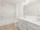 Bathroom boasts double sinks with vanity, a shower and bath combo, and tile flooring at 111 Stonewater Dr # 25, Red Cross, NC 28129