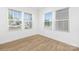 Bright, empty bedroom featuring wood-look floors and large windows at 111 Stonewater Dr # 25, Red Cross, NC 28129
