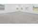 A bedroom featuring neutral carpet, white walls, and multiple windows overlooking the neighborhood at 111 Stonewater Dr # 25, Red Cross, NC 28129