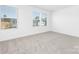Bright bedroom with large windows providing natural light and plush neutral carpeting at 111 Stonewater Dr # 25, Red Cross, NC 28129
