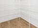 Walk-in closet provides laminate flooring with white shelving unit at 111 Stonewater Dr # 25, Red Cross, NC 28129