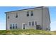 Rear exterior view of home with gray siding and multiple windows at 111 Stonewater Dr # 25, Red Cross, NC 28129