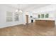 Bright, open-concept kitchen featuring white cabinets, stainless steel appliances, and a large island at 111 Stonewater Dr # 25, Red Cross, NC 28129