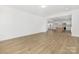 Open concept living room featuring wood-look floors and access to the kitchen at 111 Stonewater Dr # 25, Red Cross, NC 28129