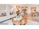 Bright living room flows into a modern kitchen with stainless steel appliances at 12136 Devon Square Ct, Charlotte, NC 28262